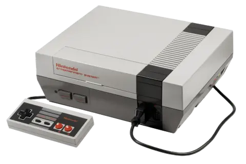 Klasyczna konsola Nintendo Entertainment System z padem. Wiele osób wspomina ją jako swoje pierwsze **stare gry na telefon**, choć to konsola.