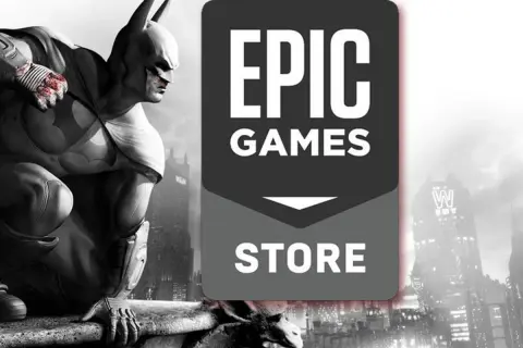 Batman na dachu, obok logo Epic Games Store. Sprawdź, jakie **epic games darmowe gry** czekają na Ciebie!