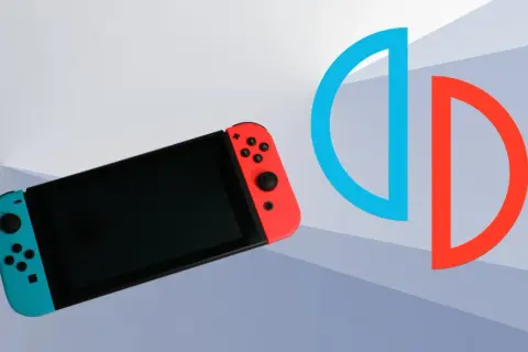 Konsola Nintendo Switch z niebieskim i czerwonym Joy-Conem obok symbolu podzielonego okręgu.