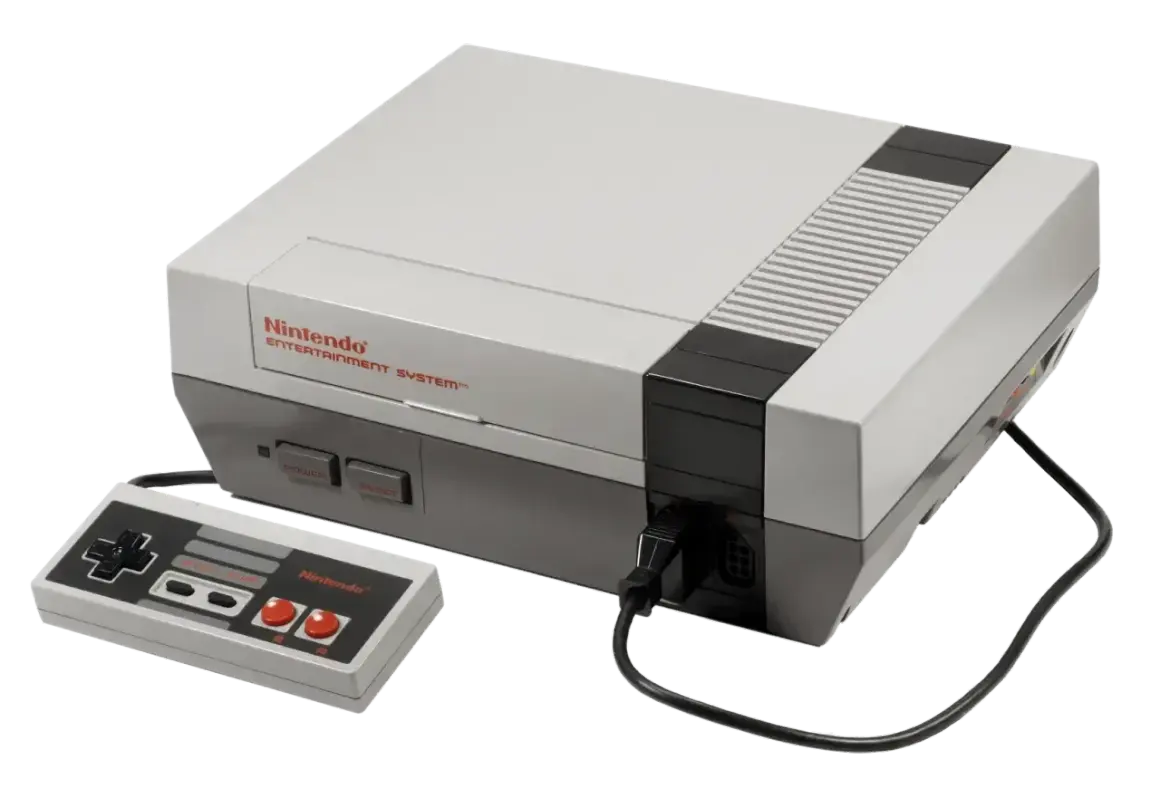 Konsola Nintendo Entertainment System z padem, klasyka **gier z dzieciństwa na komputer**.