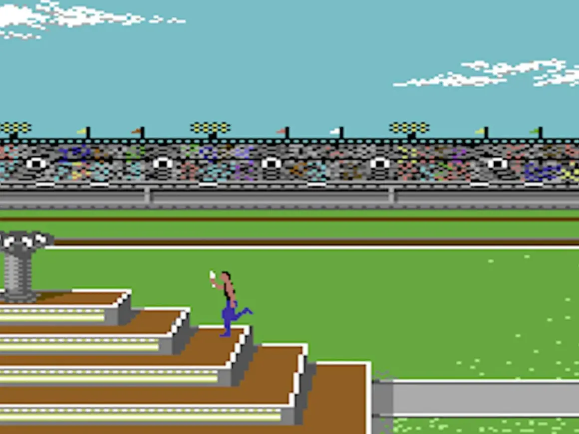 Biegacz na schodach stadionu, klasyczne gry na Commodore 64. Widownia kibicuje.