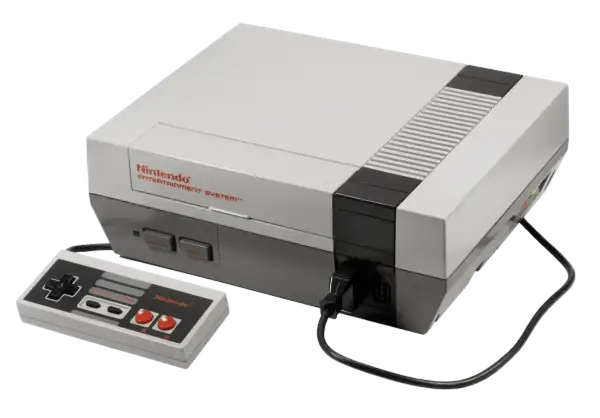 Konsola Nintendo Entertainment System z padem, klasyka **gier z dzieciństwa na komputer**.