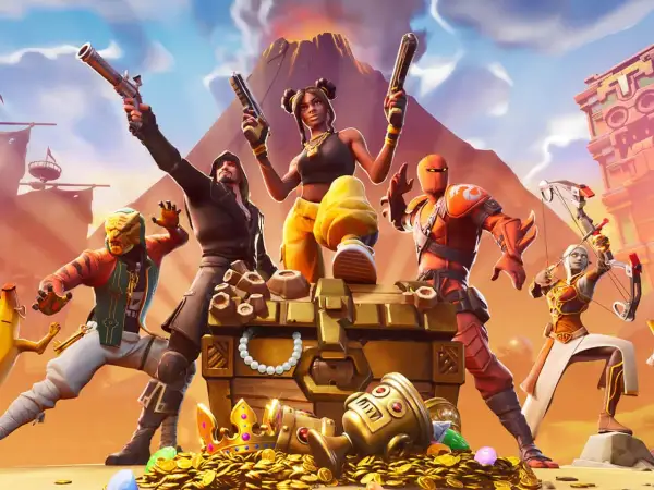 Postacie z gry Fortnite wokół skrzyni ze skarbami i złotymi monetami.
